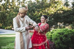 Indian bride and groom's romantic first look moment. Indian bride and groom's romantic first look moment.