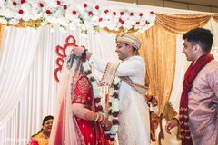 Indian groom putting garland to bride ritual. Indian groom putting garland to bride ritual.