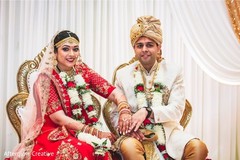 Enchanting Indian couple showing their wedding rings. Enchanting Indian couple showing their wedding rings.