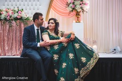 Lovely Indian wedding couple posing at reception stage. Lovely Indian wedding couple posing at reception stage.