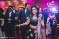 Sweet Indian bride at her wedding reception dance. Sweet Indian bride at her wedding reception dance.