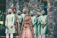 Indian couple with groomsmen Indian couple with groomsmen