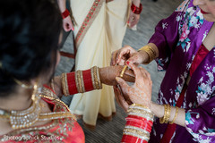 Beautiful indian bride putting her amazing bangles Beautiful indian bride putting her amazing bangles
