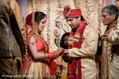 Sweet Indian couple exchanging rings Sweet Indian couple exchanging rings