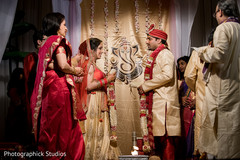 Indian bride and groom getting ready to exchange garlands Indian bride and groom getting ready to exchange garlands