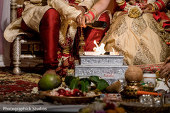 Indian couple making offerings to sacred fire