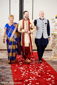 Indian groom escorted to the ceremony by his parents. Indian groom escorted to the ceremony by his parents.