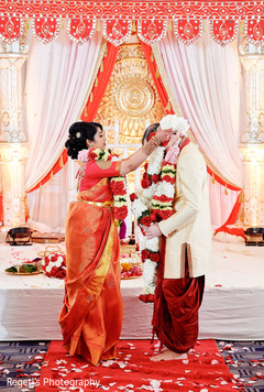 Indian couple exchanging garlands. Indian couple exchanging garlands.