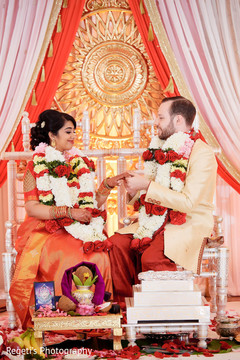Indian groom putting a ring to bride during the ceremony ritual. Indian groom putting a ring to bride during the ceremony ritual.