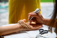 Mehndi artist at work. Mehndi artist at work.