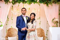 Charming Indian couple posing for reception photo shoot. Charming Indian couple posing for reception photo shoot.