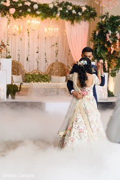 Dreamy Indian couple at their wedding reception dance. Dreamy Indian couple at their wedding reception dance.