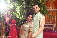 Glamorous indian couple posing at sangeet. Glamorous indian couple posing at sangeet.