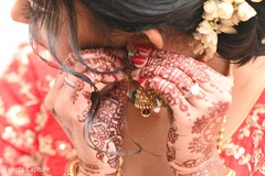 Indian bridal getting her earrings on. Indian bridal getting her earrings on.