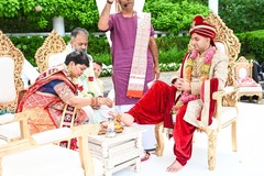 Indian groom getting his feet wash at mandap. Indian groom getting his feet wash at mandap.
