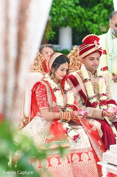 Indian couple holding the ritual petals. Indian couple holding the ritual petals.
