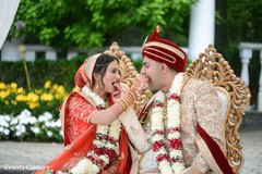Indian couple sharing food ritual. Indian couple sharing food ritual.