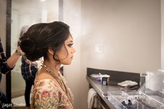 Beautiful Indian bride getting her hair done. Beautiful Indian bride getting her hair done.
