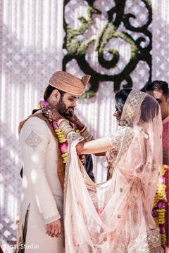 Indian bride putting the garland to her groom. Indian bride putting the garland to her groom.