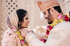 Indian groom putting necklace to his bride. Indian groom putting necklace to his bride.