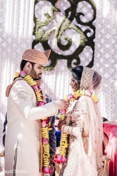 Majestic indian couple exchanging garlands. Majestic indian couple exchanging garlands.