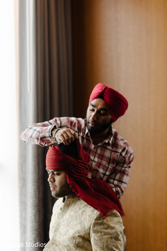 Indian groom preparing his wedding outfit. Indian groom preparing his wedding outfit.