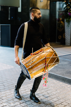 Dhol player. Dhol player.