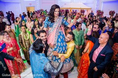 Indian bride being lifted by special guests. Indian bride being lifted by special guests.