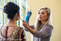 Makeup artist assisting the bride. Makeup artist assisting the bride.
