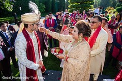 Our elegant groom being greeted by bride's parents. Our elegant groom being greeted by bride's parents.