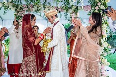 Beautiful Indian couple exchanging garlands. Beautiful Indian couple exchanging garlands.