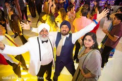 Happy and elegant family enjoying the reception party. Happy and elegant family enjoying the reception party.