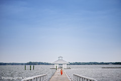 Indian bride and groom walking by the sea. Indian bride and groom walking by the sea.