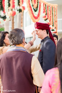 Indian groom being welcome from baraat procession. Indian groom being welcome from baraat procession.