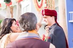 Indian groom receiving the red mark on his forehead. Indian groom receiving the red mark on his forehead.