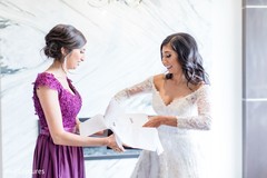 Indian bride opening a present. Indian bride opening a present.