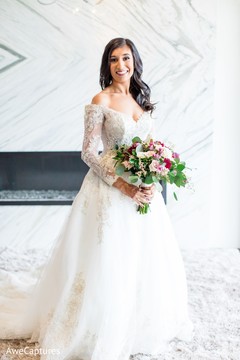 Enchanting Indian bride on her white wedding dress. Enchanting Indian bride on her white wedding dress.