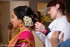 Indian bride getting her hair style done. Indian bride getting her hair style done.