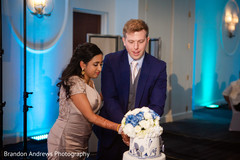 Cheerful Indian bride and groom cutting the cake. Cheerful Indian bride and groom cutting the cake.