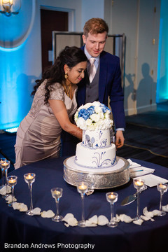 Indian wedding reception cutting the cake moment. Indian wedding reception cutting the cake moment.