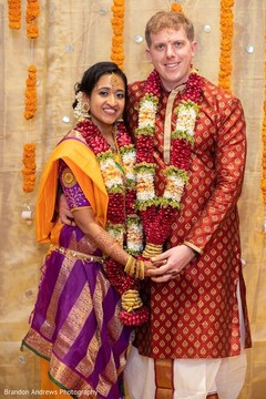 Indian couple posing with their wedding ceremony look. Indian couple posing with their wedding ceremony look.
