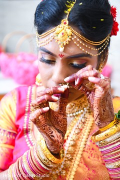 Lovely Indian bride putting her ceremony nose ring. Lovely Indian bride putting her ceremony nose ring.