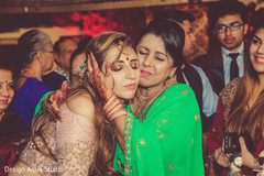 Lovely Indian bride being hug by her mother in law. Lovely Indian bride being hug by her mother in law.