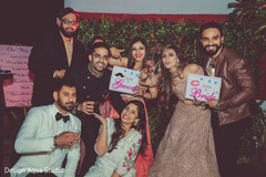 Indian couple and their loved ones posing for the photo. Indian couple and their loved ones posing for the photo.