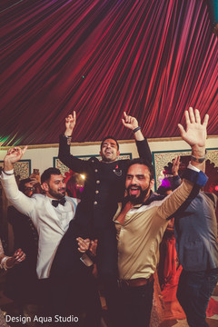 Lifted like a champion, our Indian groom looks so happy. Lifted like a champion, our Indian groom looks so happy.