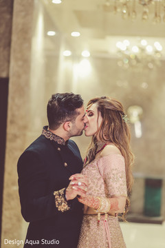 Sweet kiss captured in photo shoot. Sweet kiss captured in photo shoot.