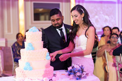 Indian bride and groom cutting the cake. Indian bride and groom cutting the cake.