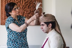 Indian groom getting the kilangi on his pagri. Indian groom getting the kilangi on his pagri.