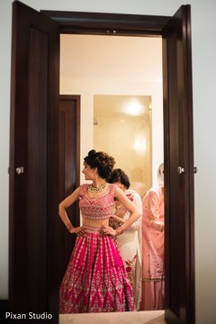 Indian bride getting her lehenga on. Indian bride getting her lehenga on.