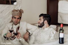 Charming Indian groom having cheers. Charming Indian groom having cheers.